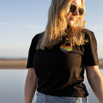 Model wearing black organic LGBTQ t-shirt outdoors