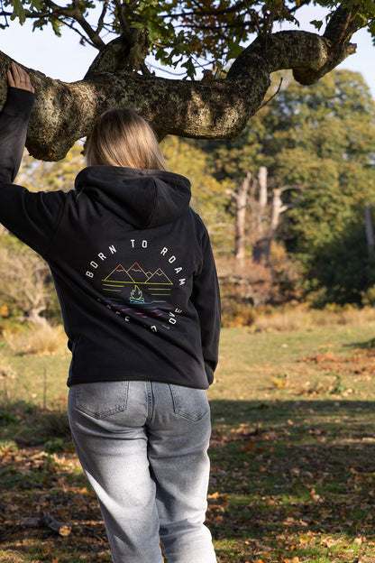Model wearing Born to Roam LGBTQ hiking hoodie