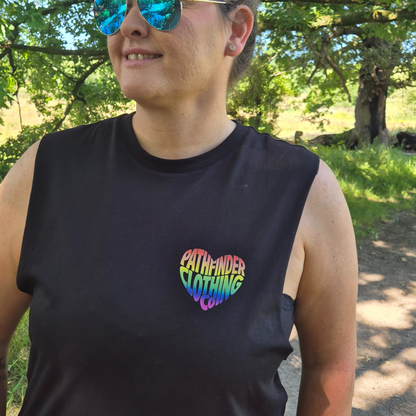 Model wearing Born to Roam LGBTQ pride vest outdoors
